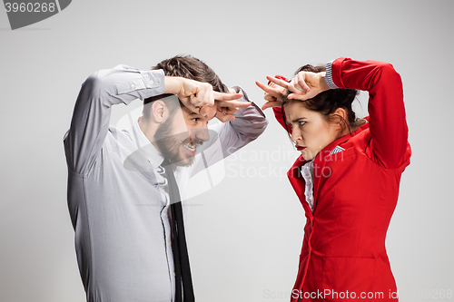 Image of The business man and woman communicating on a gray background