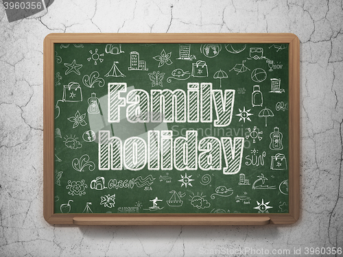 Image of Travel concept: Family Holiday on School board background