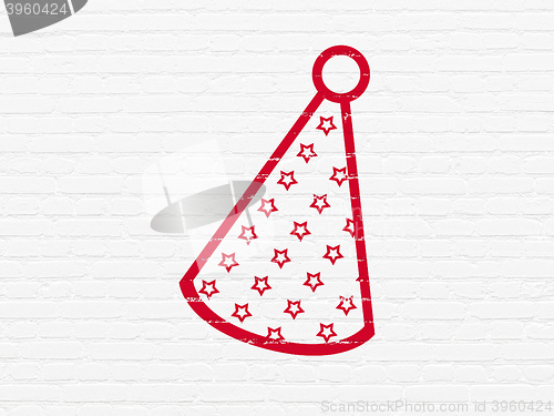 Image of Holiday concept: Party Hat on wall background