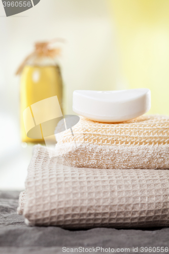 Image of spa towels and aromatic massage oil