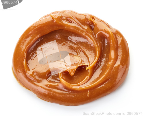 Image of melted caramel on white background