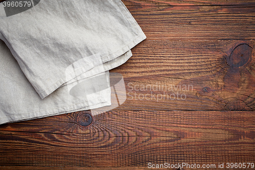 Image of linen napkin on wooden table