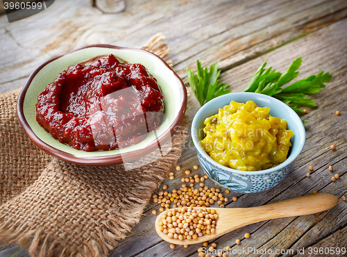 Image of various dip sauces on wooden table