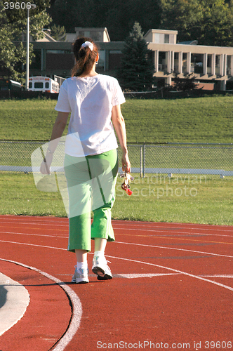 Image of woman walking on track