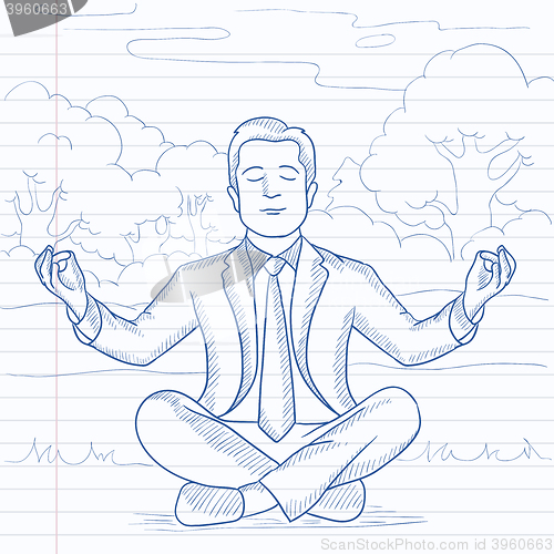 Image of Businessman meditating in lotus pose.