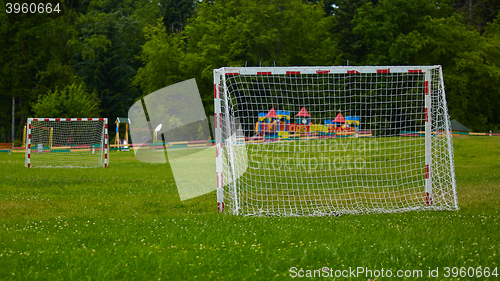 Image of view of a net on vacant soccer pitch.