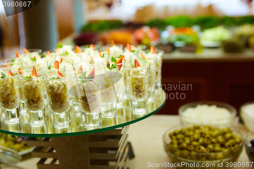 Image of Dessert table for party. akes and sweetness. Shallow dof