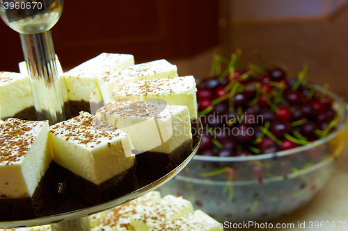 Image of Dessert table for party. akes and sweetness. Shallow dof