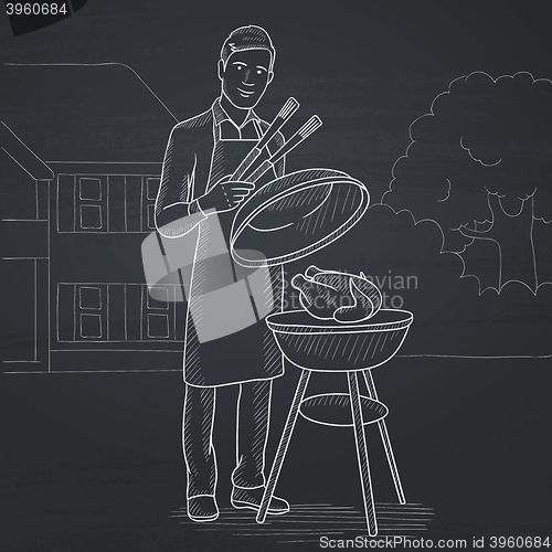 Image of Man preparing barbecue.