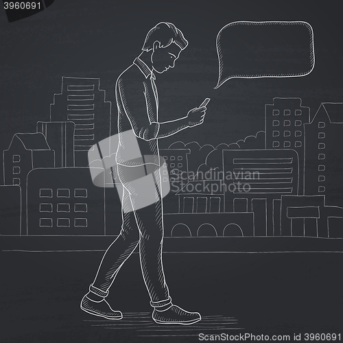 Image of Man walking with smartphone.