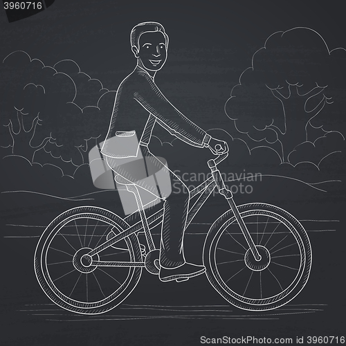 Image of Man riding bicycle.