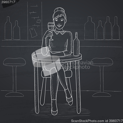 Image of Woman sitting at bar.