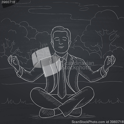 Image of Businessman meditating in lotus pose.