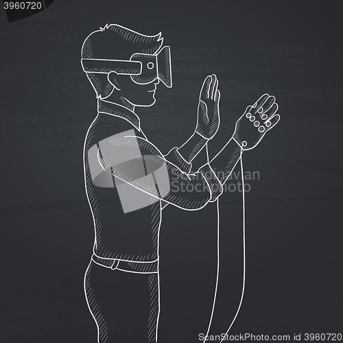 Image of Man wearing virtual reality headset.
