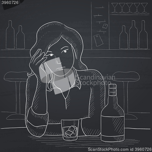 Image of Woman sitting at bar.