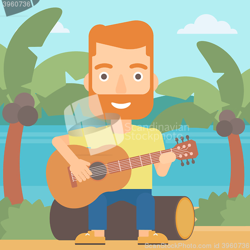 Image of Man playing guitar.