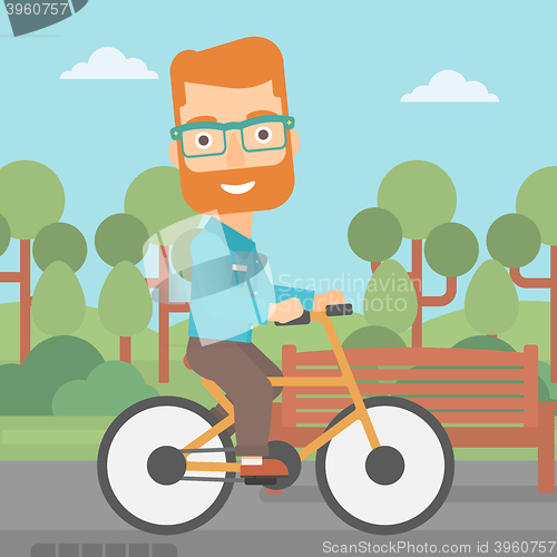 Image of Man riding bicycle.