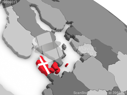 Image of Denmark on globe with flag