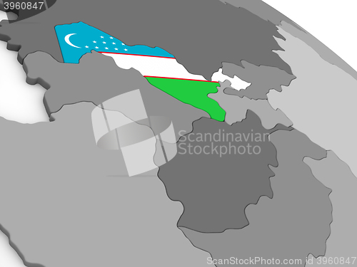 Image of Uzbekistan on globe with flag