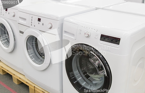 Image of Washing machines are sold in the store.