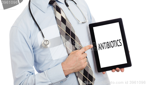 Image of Doctor holding tablet - Antibiotics