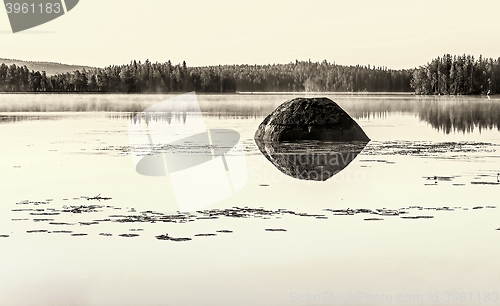 Image of Karelian landscape with a lake in sepia