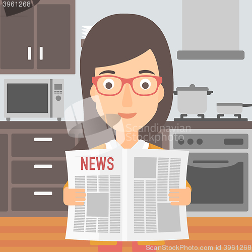 Image of Woman reading newspaper.