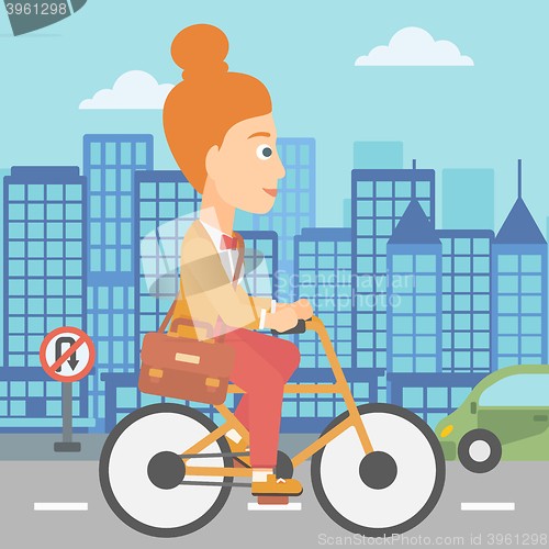 Image of Woman cycling to work.