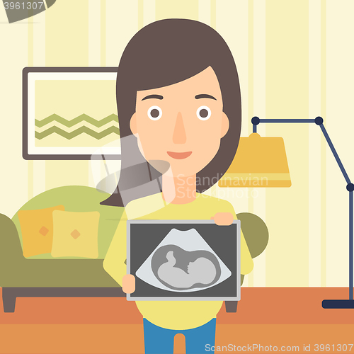 Image of Pregnant woman with ultrasound image.