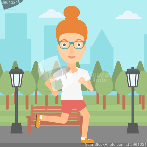 Image of Sportive woman jogging.