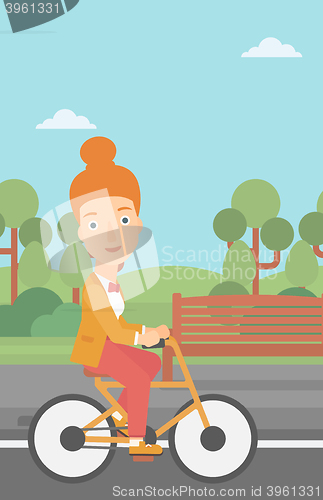 Image of Woman riding bicycle.