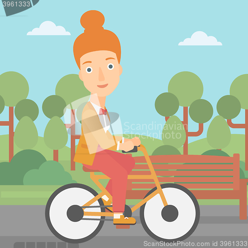 Image of Woman riding bicycle.