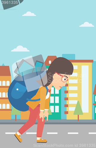 Image of Woman with backpack full of devices.