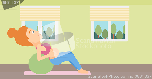 Image of Pregnant woman on gymnastic ball.