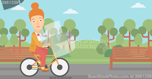 Image of Woman riding bicycle.