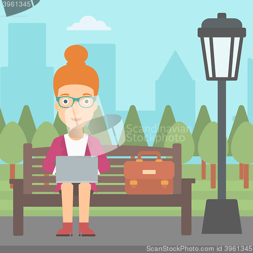 Image of Woman working on laptop.