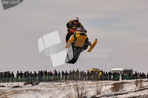 Image of High jump of sportsman on snowmobile