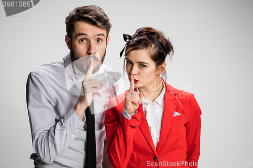 Image of The business man and woman calling for silence