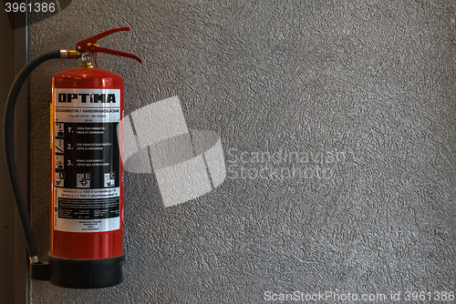 Image of Fire extinguisher on the wall.