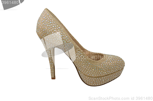 Image of High heel gold shoe, covered in sparkling gems