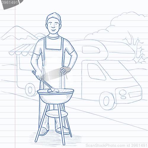 Image of Man preparing barbecue.