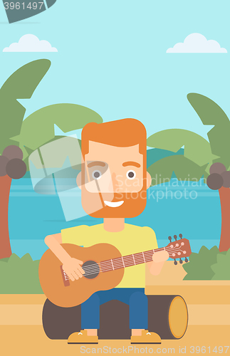 Image of Man playing guitar.