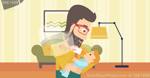 Image of Man feeding baby.