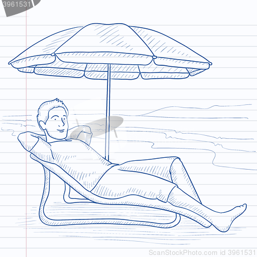 Image of Man sitting in chaise longue.