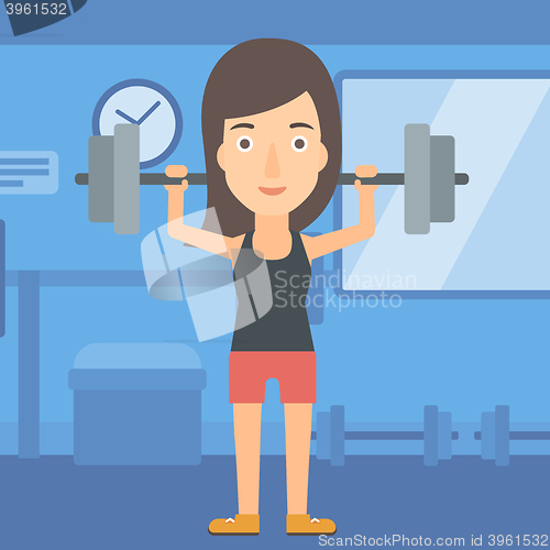 Image of Woman lifting barbell.