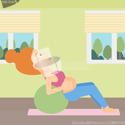 Image of Pregnant woman on gymnastic ball.