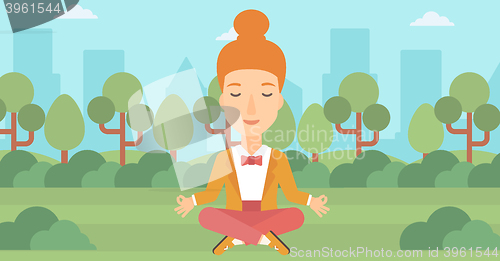 Image of Business woman meditating in lotus pose.