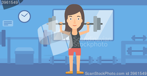 Image of Woman lifting barbell.