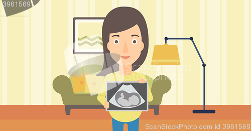 Image of Pregnant woman with ultrasound image.