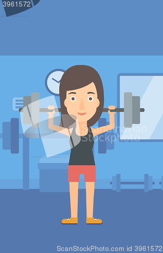 Image of Woman lifting barbell.